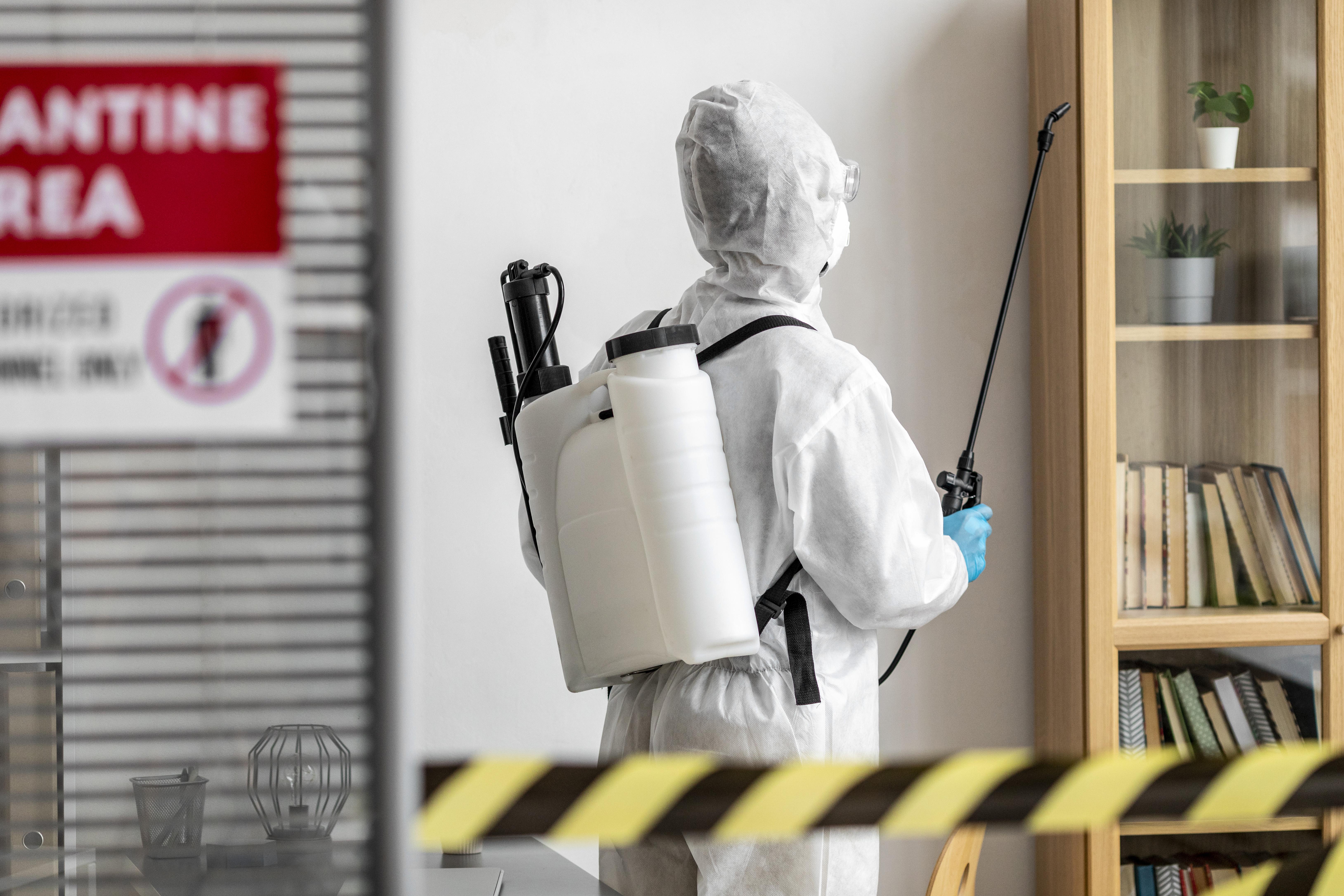 Professional pest control technician at work in Penang